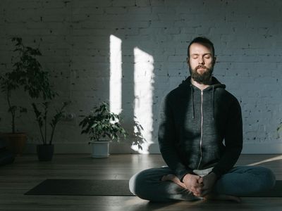Focused person practicing mindfulness in a quiet room.